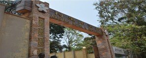 A stone archway with the text "ARIRANG HOTEL & RESTAURANT" indicating the entrance to a hotel and restaurant. - Arirang Hotel (Kampala)