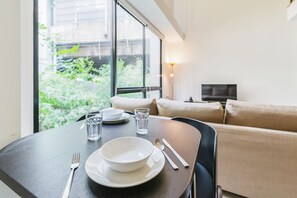 Standard Apartment, 1 Bedroom | Living area | Flat-screen TV - The Nest By Favstay (Bangkok)