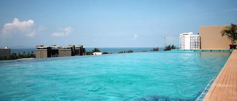 Outdoor pool, open 7:00 AM to 7:00 PM, sun loungers