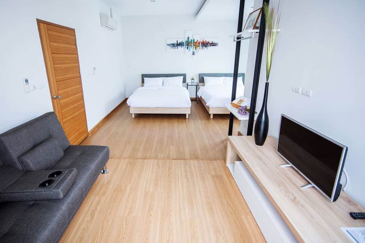 Family Quadruple Room | Living area | 32-inch flat-screen TV with digital channels, TV