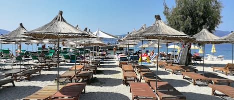 On the beach, sun-loungers, beach umbrellas