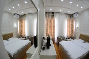 Suite junior, 1 cama individual grande | Ropa de cama de alta calidad y minibar