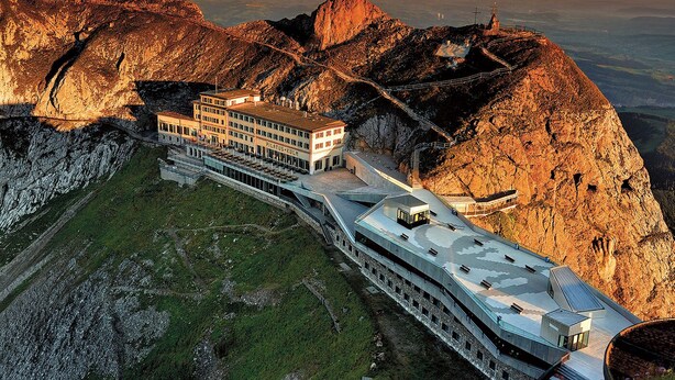 A modern hotel with a unique terraced design, situated on a mountain slope with panoramic views. - Hotel Pilatus Kulm (Kriens)