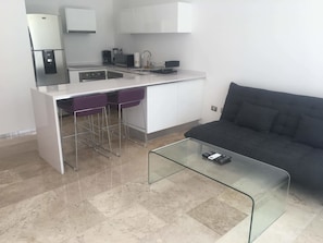 Deluxe Apartment, 1 Bedroom | Living area | Flat-screen TV, pay movies