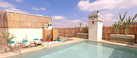Outdoor pool, open 9:00 AM to 9:00 PM, pool umbrellas, sun loungers