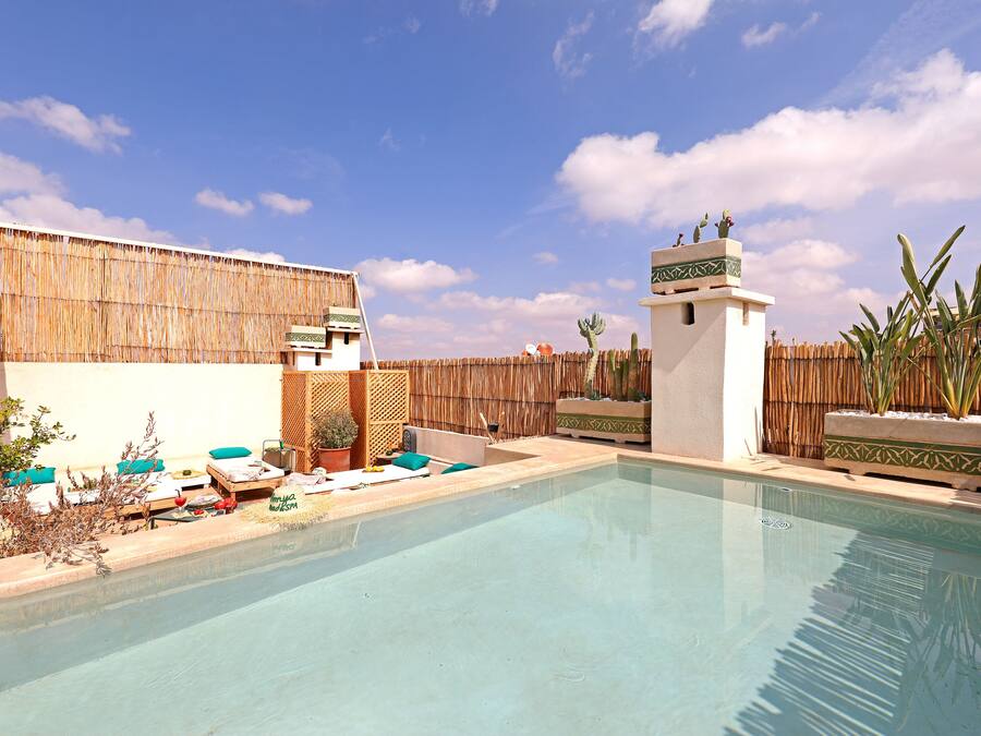 Outdoor pool, open 9:00 AM to 9:00 PM, pool umbrellas, sun loungers