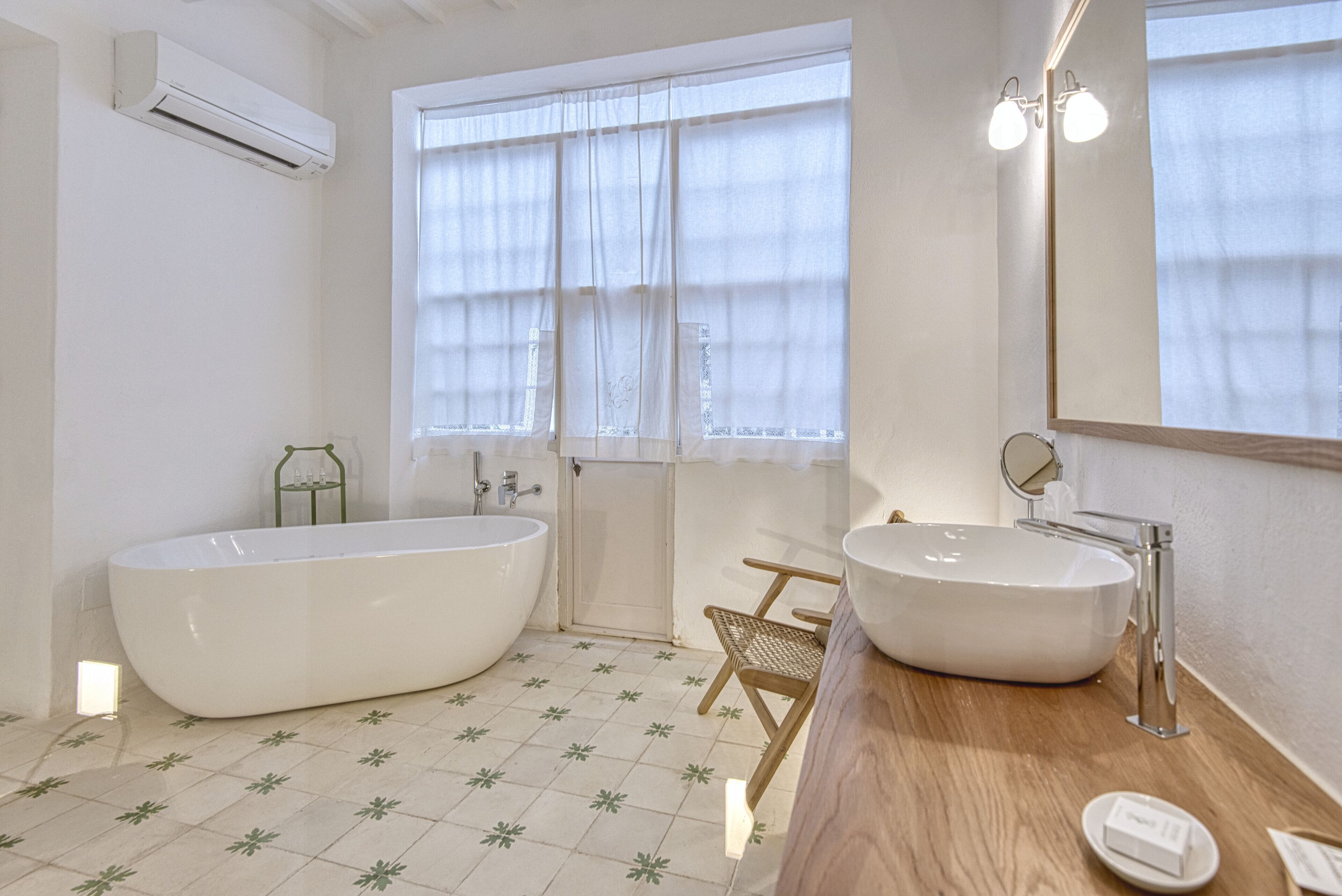 deluxe con patio | bathroom | rainfall showerhead, free toiletries, hair dryer, bathrobes