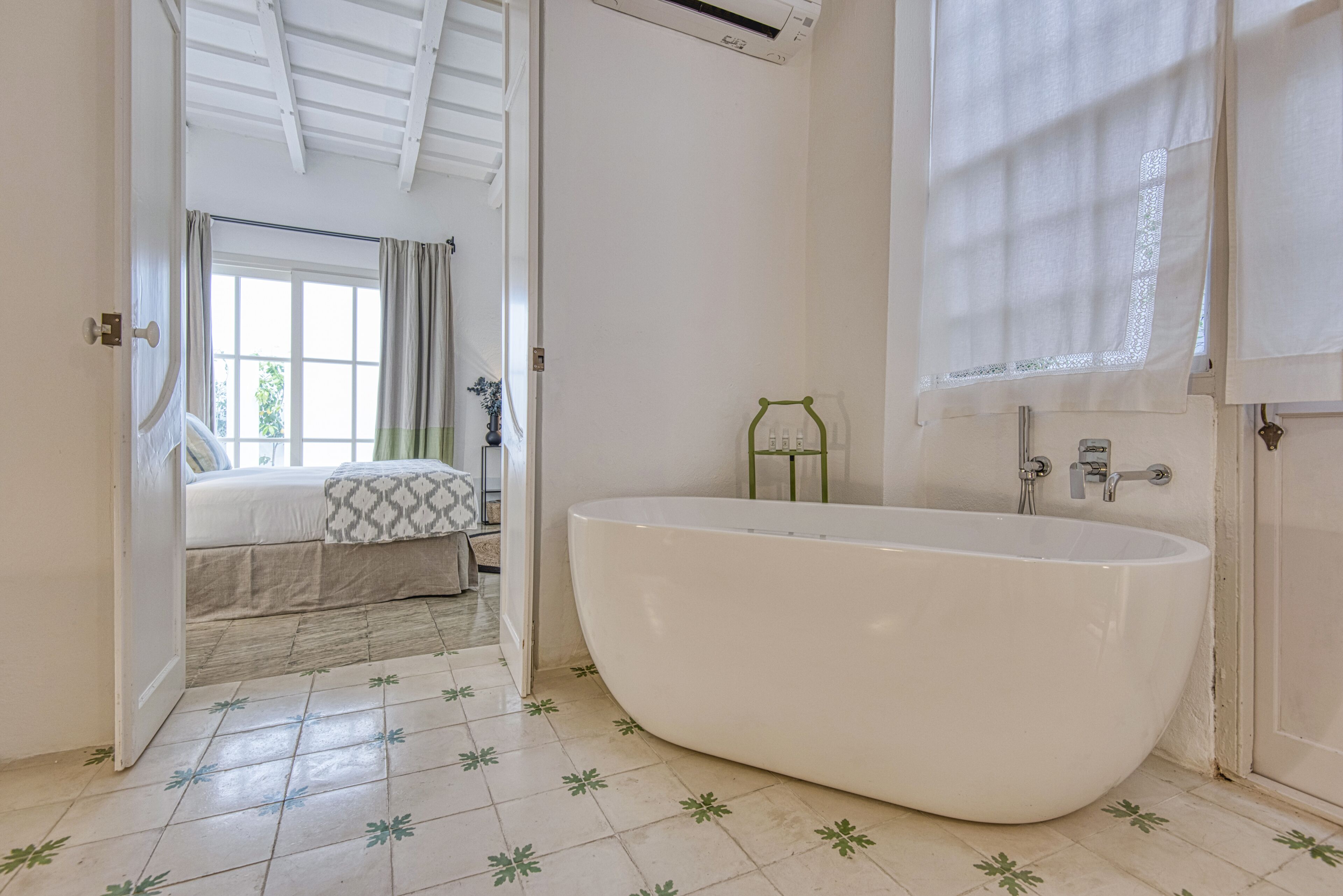 deluxe con patio | bathroom | rainfall showerhead, free toiletries, hair dryer, bathrobes
