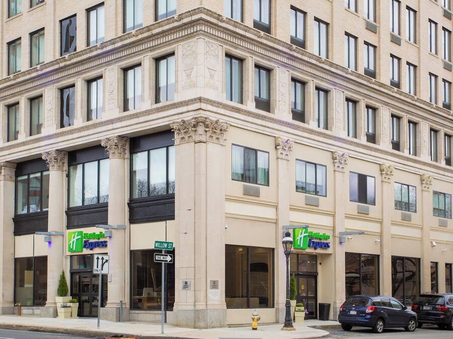 A hotel with a classic architectural style, featuring large windows and a prominent entrance.
