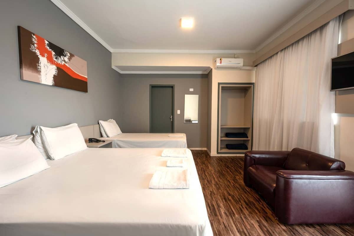 Premium Quadruple Room | Minibar, blackout drapes, free WiFi, bed sheets