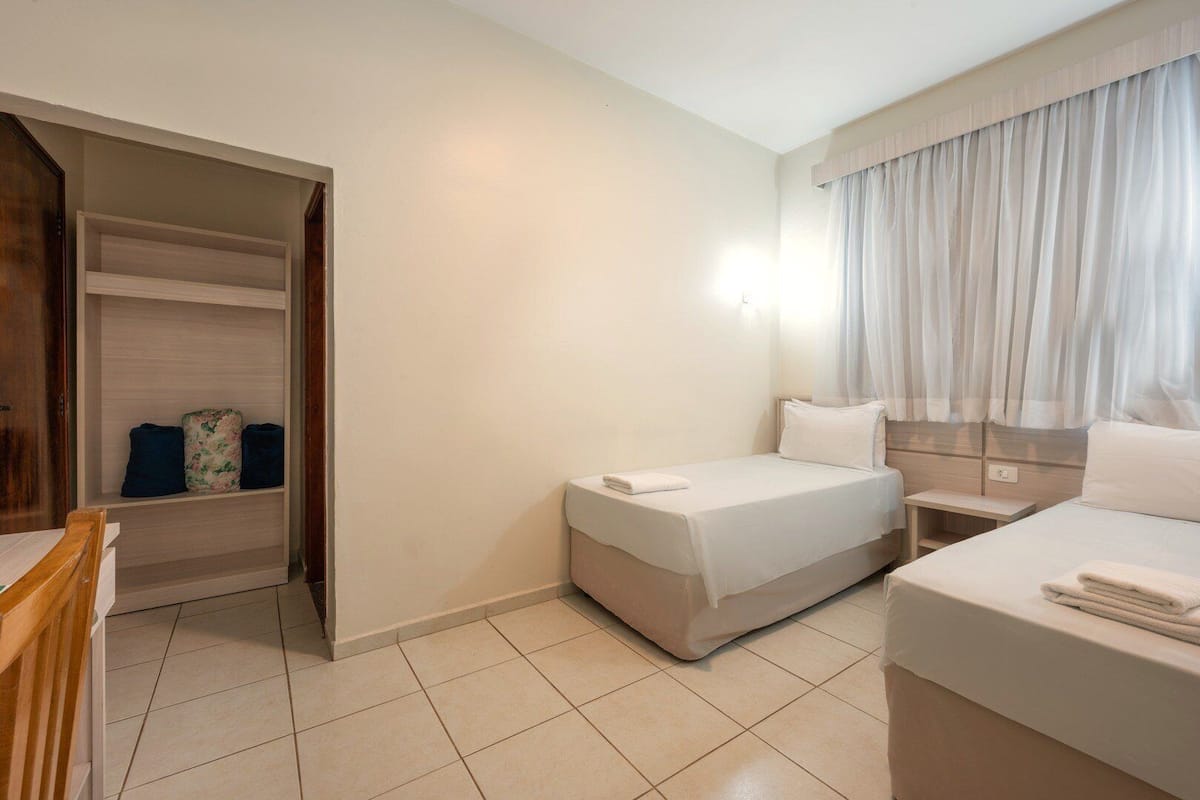 Deluxe Triple Room | Minibar, blackout drapes, free WiFi, bed sheets