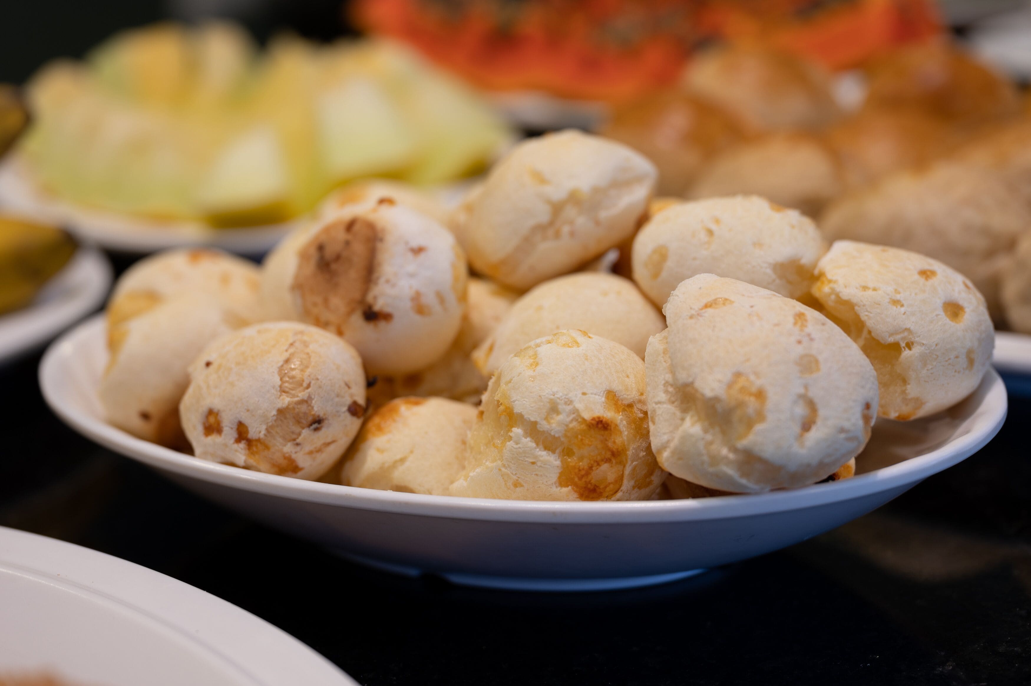 A bowl of cheese bread.