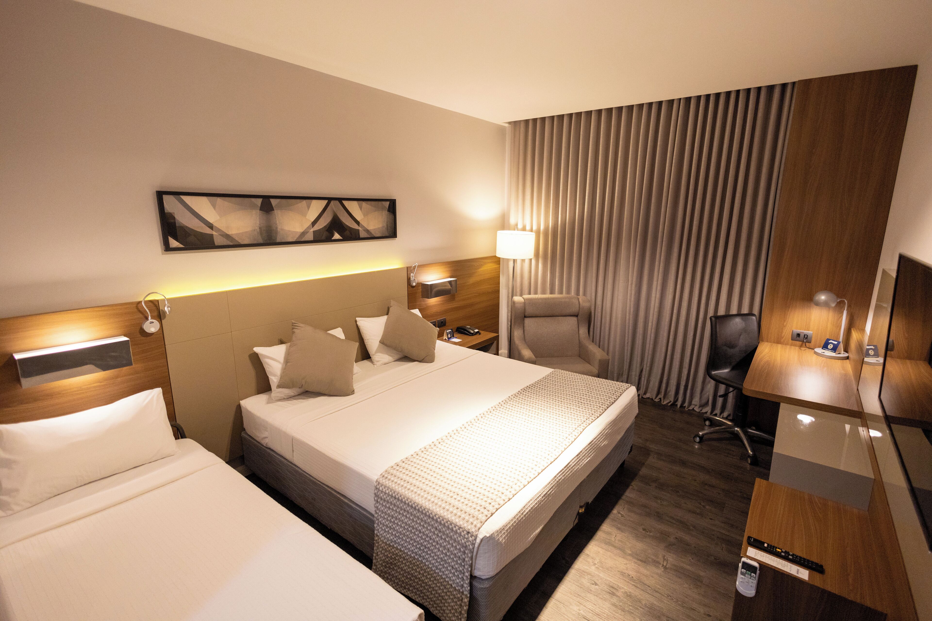 superior triple room | minibar, in-room safe, individually decorated, desk