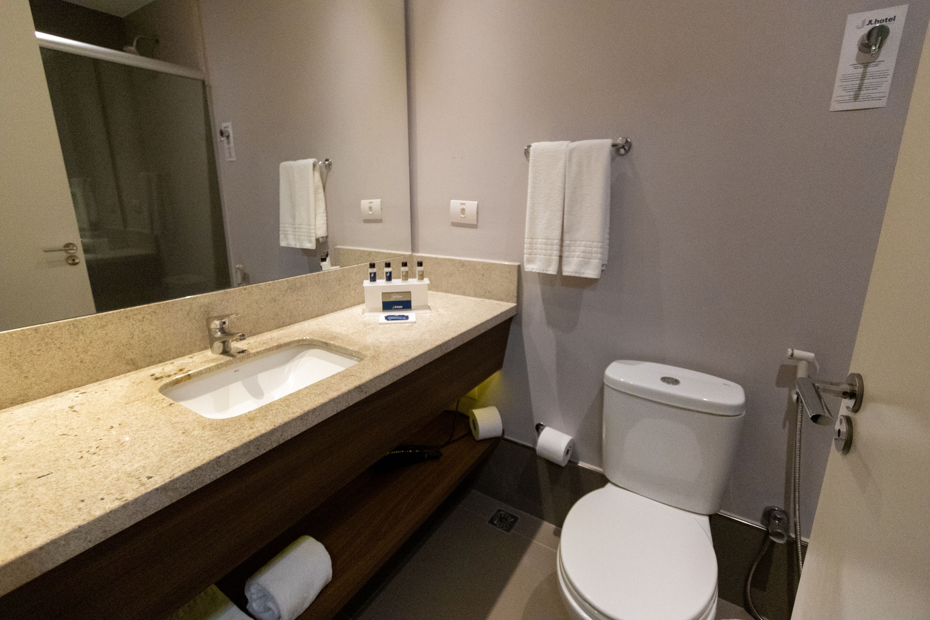 shower, designer toiletries, hair dryer, towels