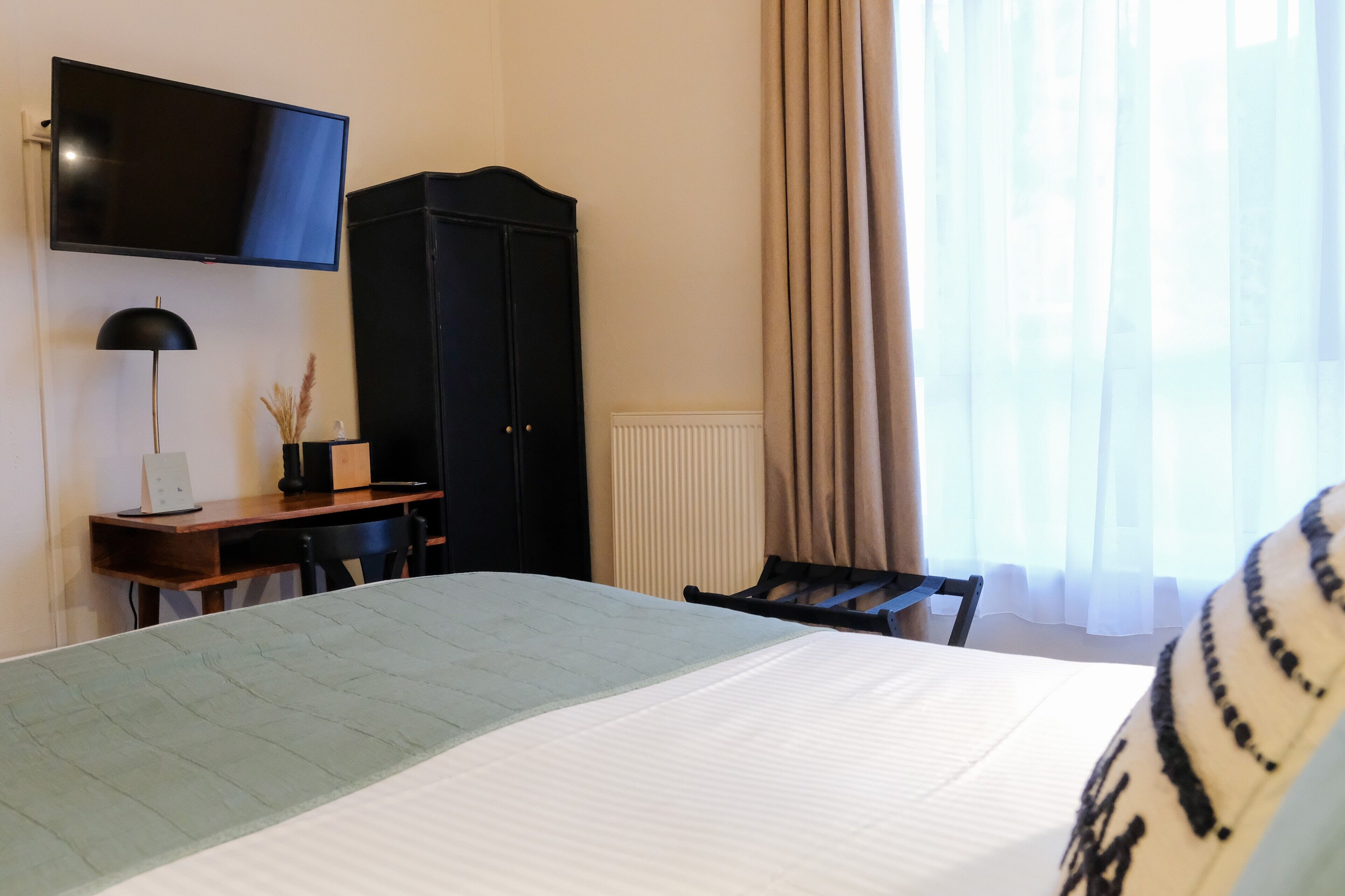 classic room, 1 queen bed, non smoking, city view | premium bedding, in-room safe, desk, laptop workspace