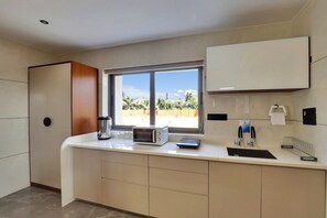 Coffee/tea maker, electric kettle, cleaning supplies, paper towels - Goverdhan Greens Resort Dwarka (Dwarka)