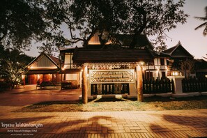 A traditional building with a sign for the Royal Peacock Boutique Hotel. - Royal Peacock Boutique Hotel (Luang Prabang)