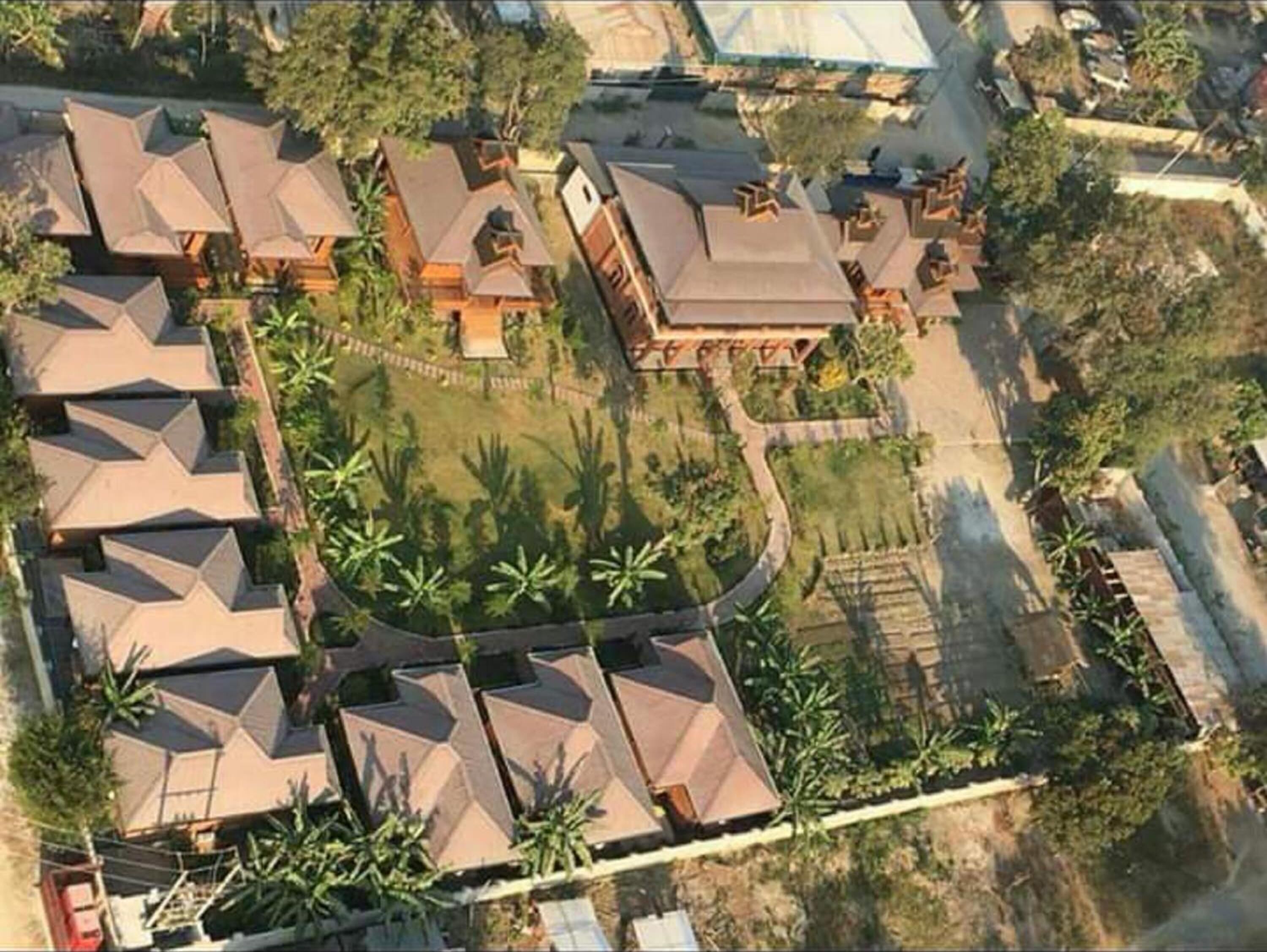 A residential area with multiple houses, each with a distinct roof design.