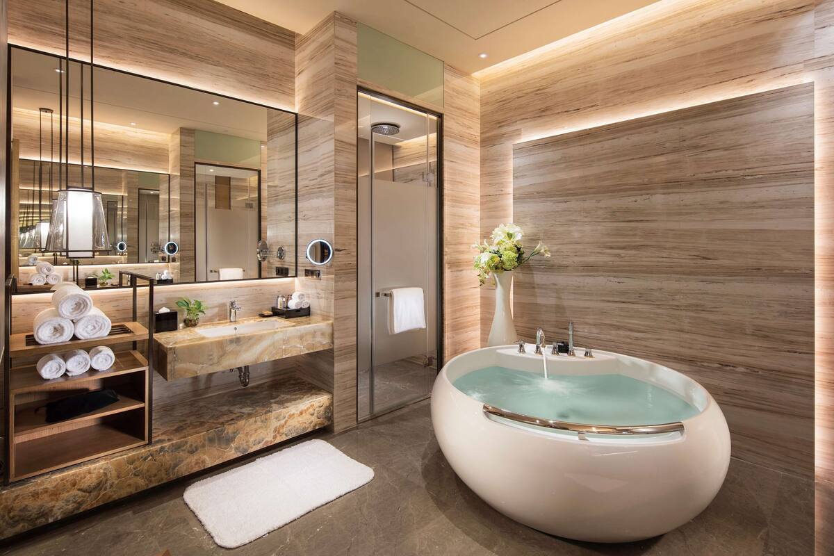 king one bedroom presidential suite | bathroom | separate bathtub and shower, deep-soaking bathtub, rainfall showerhead