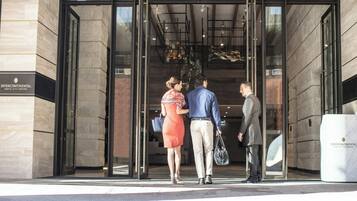 A building entrance with glass doors, a sign reading 'Intercontinental Perth City Centre,' and a clear view into the interior.