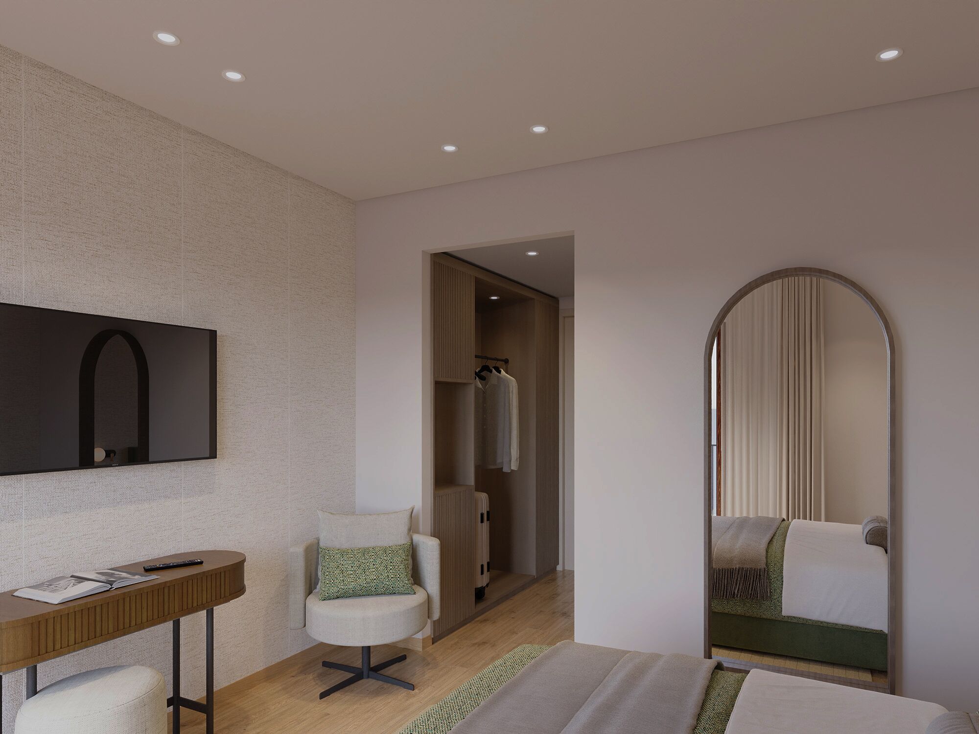 Una habitación de hotel moderna con una televisión de pantalla plana, un escritorio de madera, un sillón cómodo, una cama con una manta verde y un espejo grande.