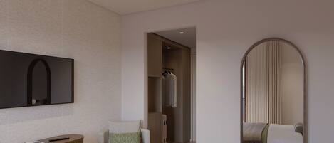 Una habitación de hotel moderna con una televisión de pantalla plana, un escritorio de madera, un sillón cómodo, una cama con una manta verde y un espejo grande.