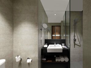 A modern bathroom with a large mirror, a sink, a shower, and a toilet. - Mercure Chennai Sriperumbudur Hotel (Sriperumbudur)