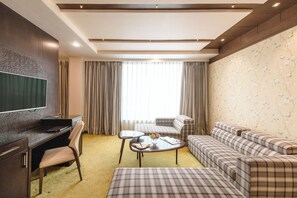 Suite | Living area | 32-inch flat-screen TV with satellite channels, TV - Grand Xenia Ajmer (Ajmer)