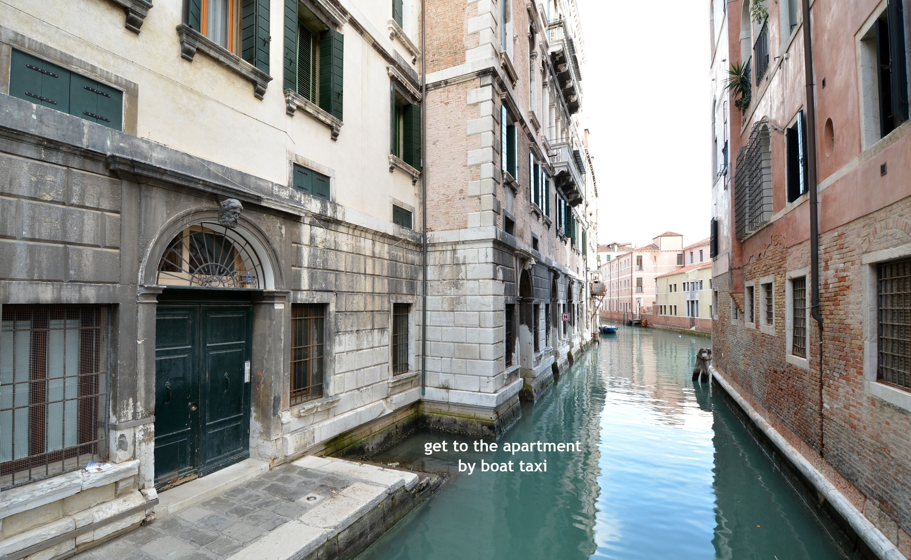 A narrow canal with buildings on either side.