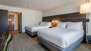 A hotel room with two beds, a desk, a chair, a lamp, and a door leading to another room. - Holiday Inn Express & Suites Atchison by IHG (Atchison)