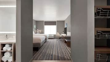 Ropa de cama hipoalergénica y caja de seguridad en la habitación