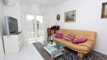 Apartment, 1 Bedroom, Balcony | Living area | TV