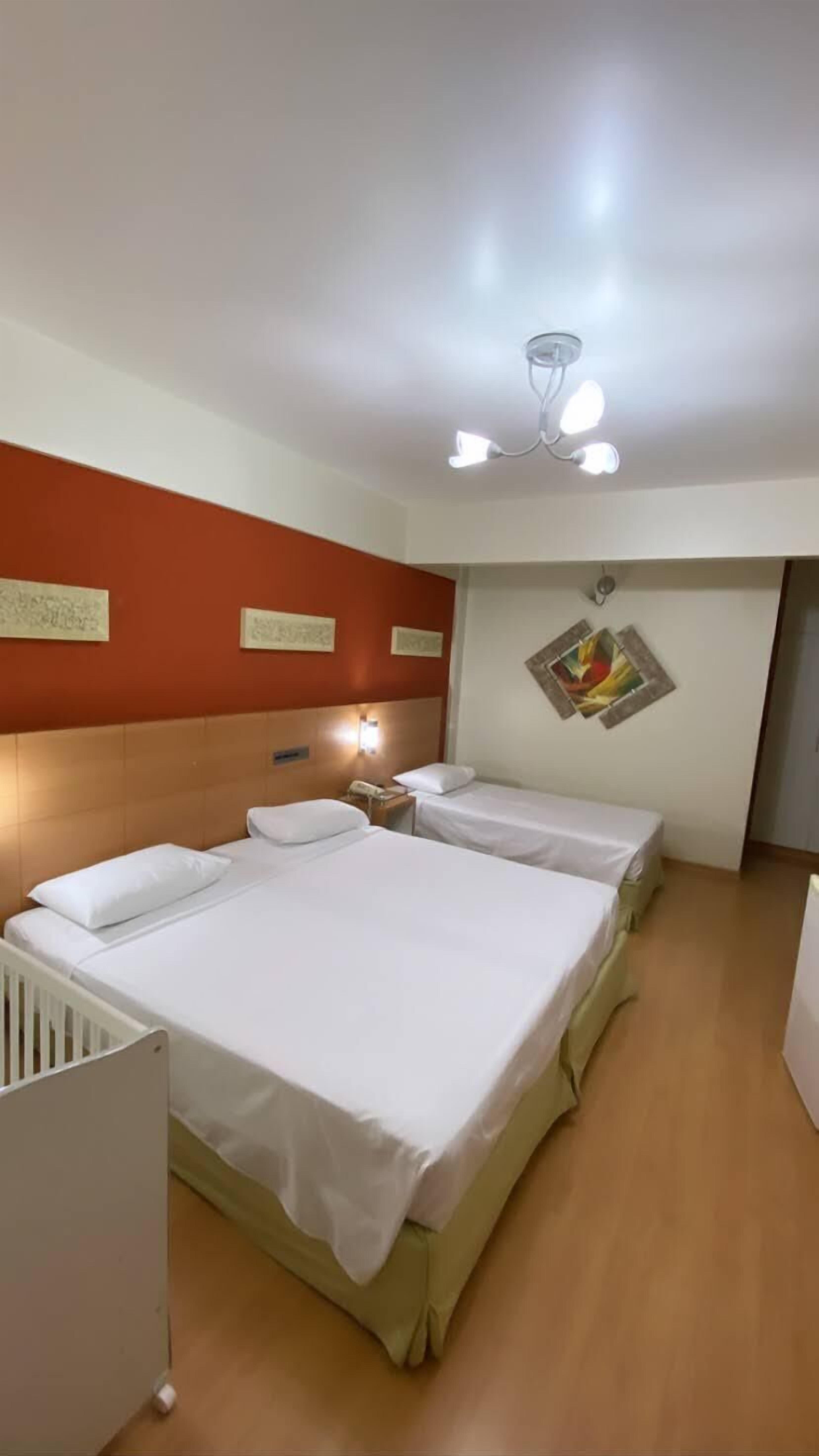 deluxe triple room | minibar, in-room safe, blackout curtains, soundproofing