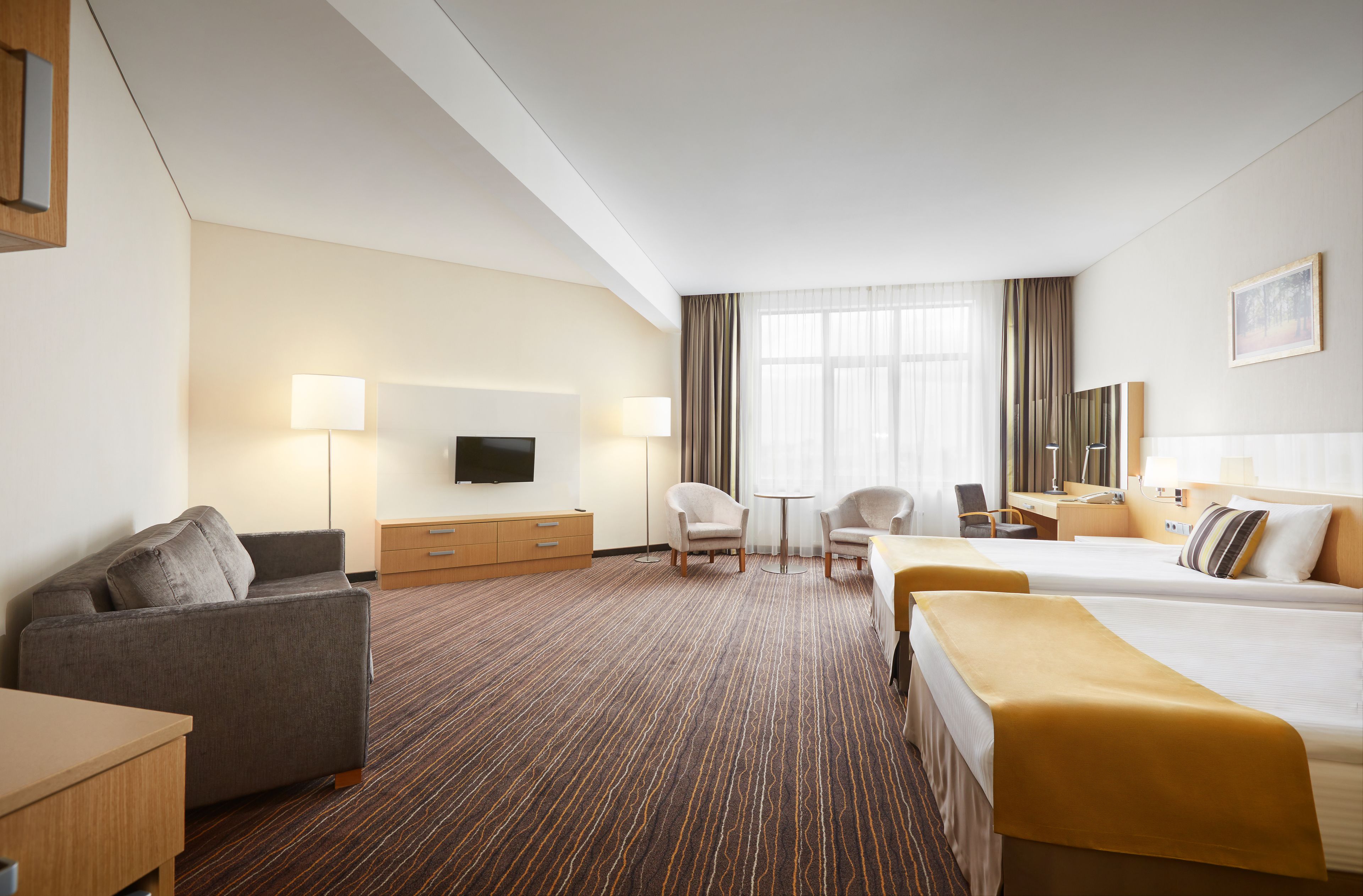 comfort twin room with aquazone access | living area | lcd tv