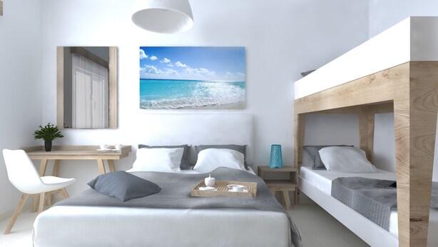 A modern bedroom with a large bed, two smaller beds, a desk, and a chair. - Philoxenia Earia (Volvi)