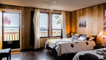 Family Room, 2 Double Beds | Individually decorated, desk, blackout drapes, iron/ironing board