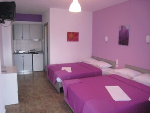 Quadruple Room, Pool View | Iron/ironing board, free cribs/infant beds, free WiFi