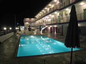 Outdoor pool, pool umbrellas, sun loungers