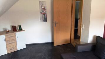 Basic Apartment, 3 Bedrooms, Non Smoking, Kitchen | Living area | TV