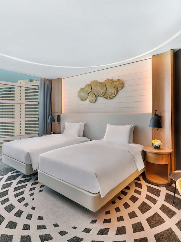Enjoy city views from the large window, relax in the armchair, and work at the desk.