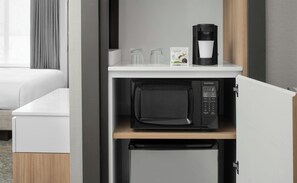 Desk, laptop workspace, iron/ironing board, free cribs/infant beds