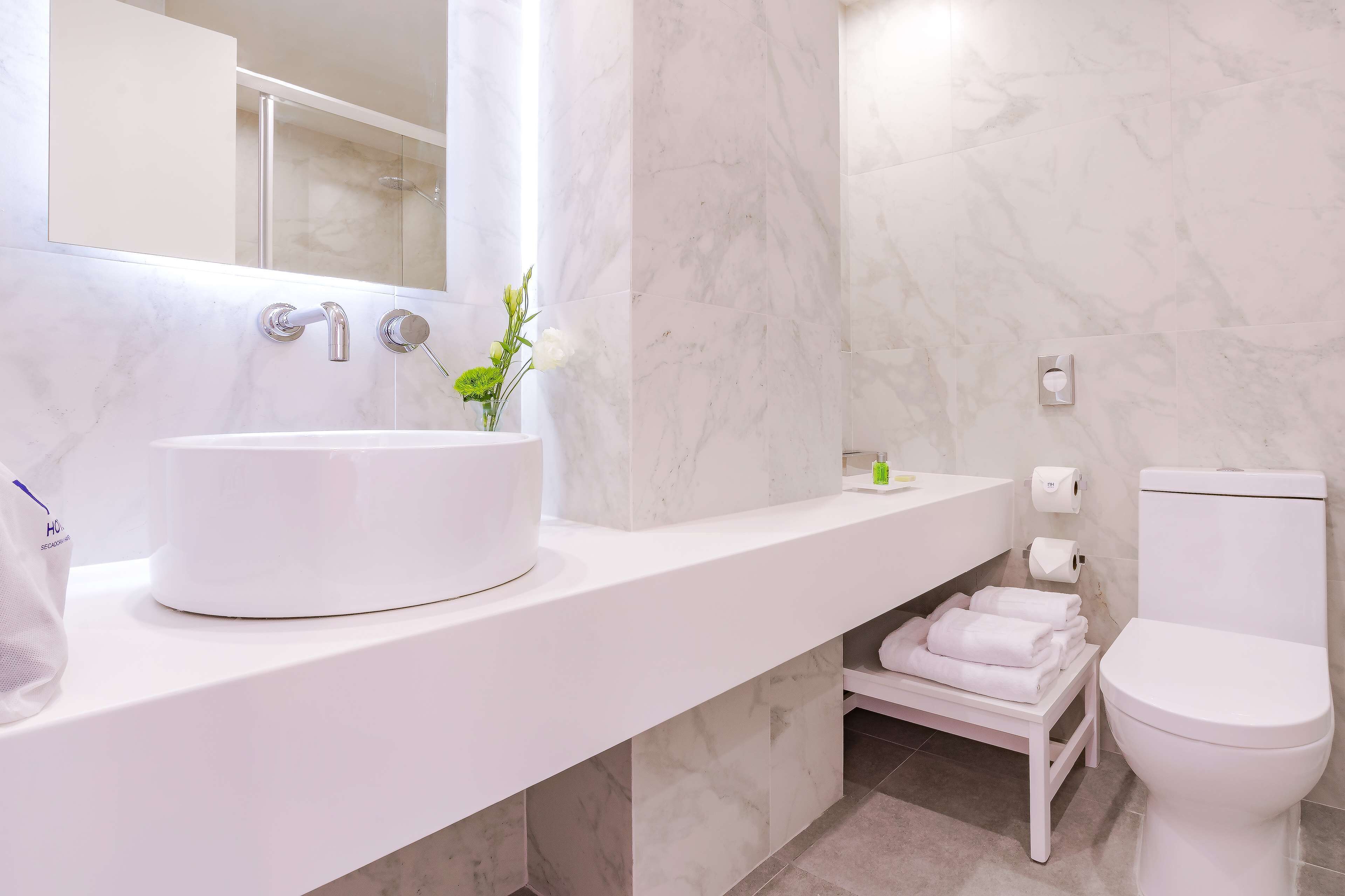 eco-friendly toiletries, hair dryer, towels, soap