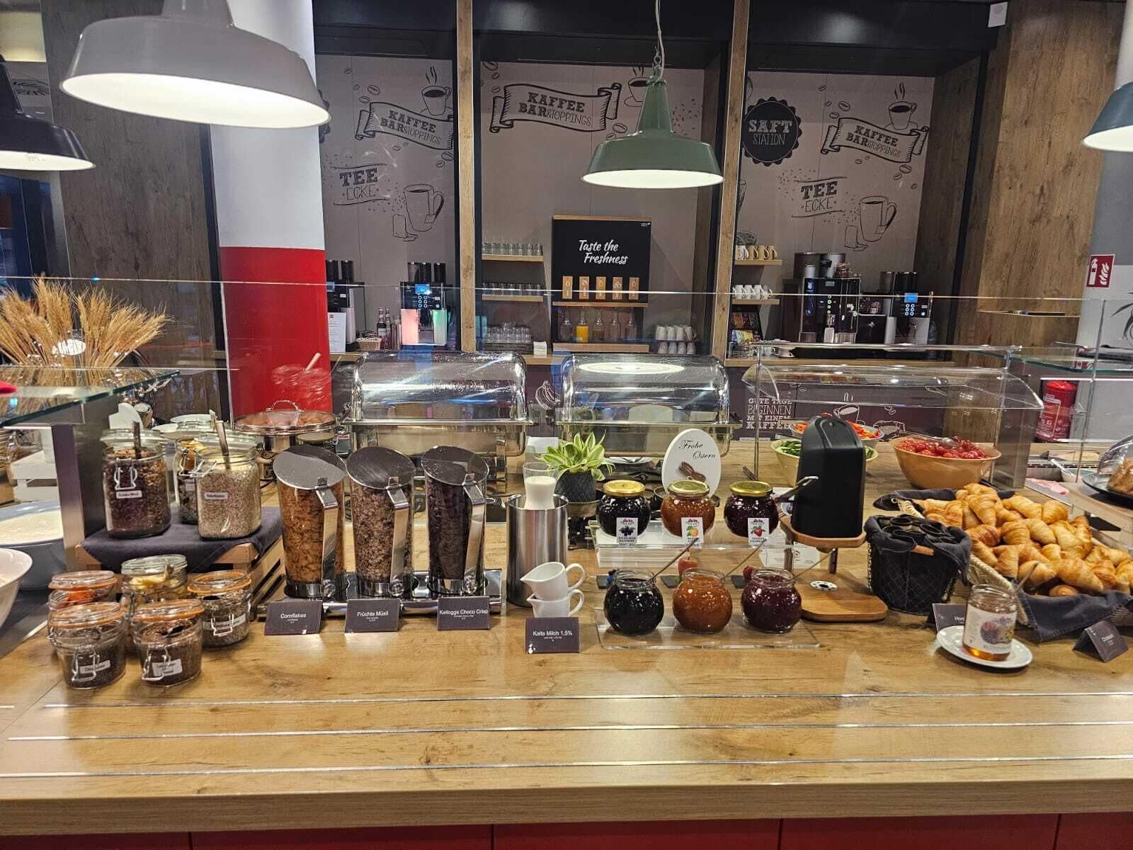 A breakfast buffet with various food items and condiments.