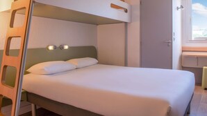 A bunk bed with a ladder, a bedside table, a wall-mounted lamp, and a door. - ibis budget Airport Marseille Provence (Vitrolles)