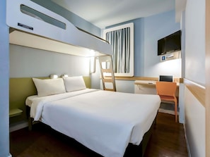 Hypo-allergenic bedding, desk, laptop workspace, blackout curtains
