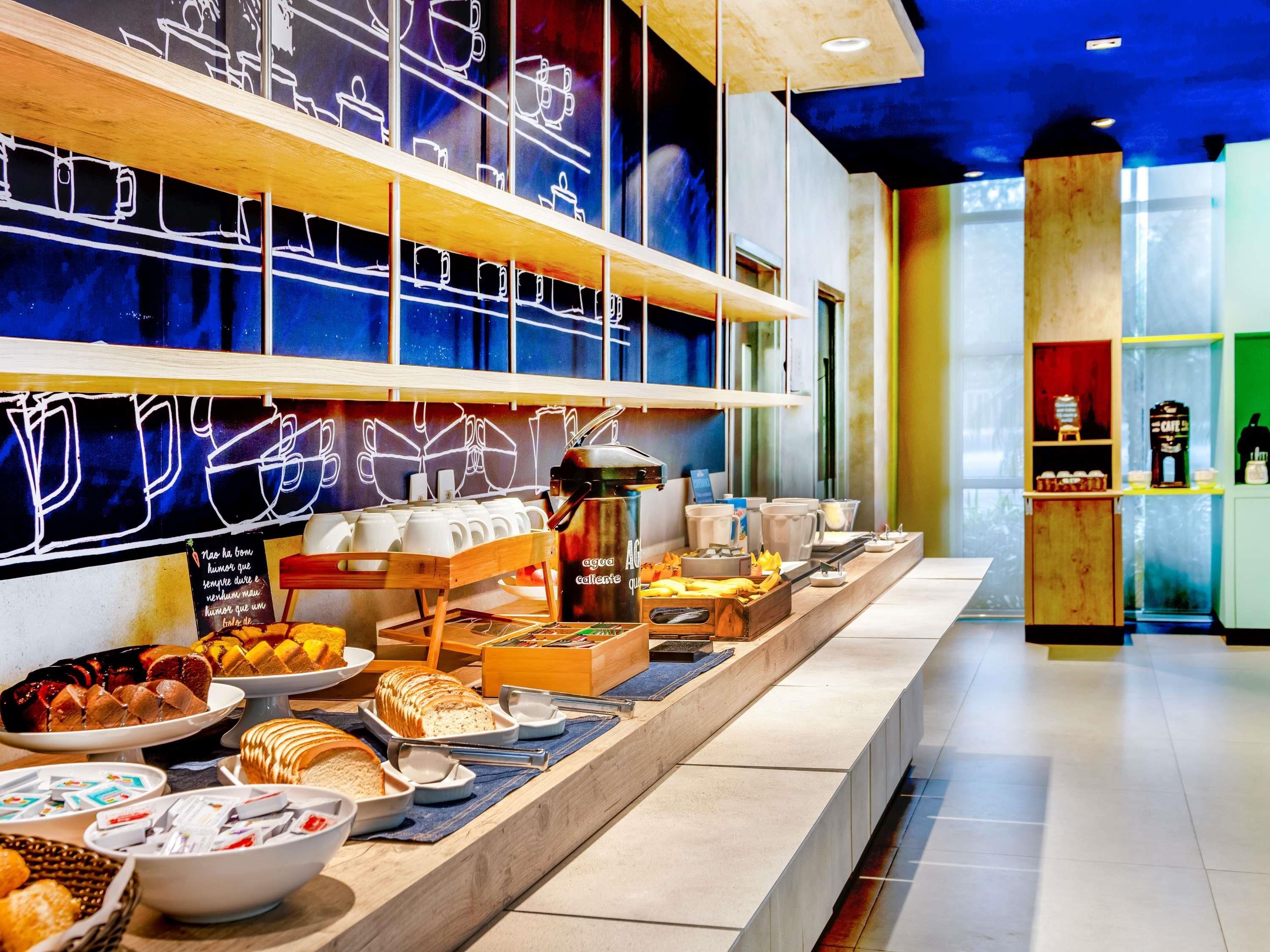 A breakfast buffet with various food items and a coffee station.