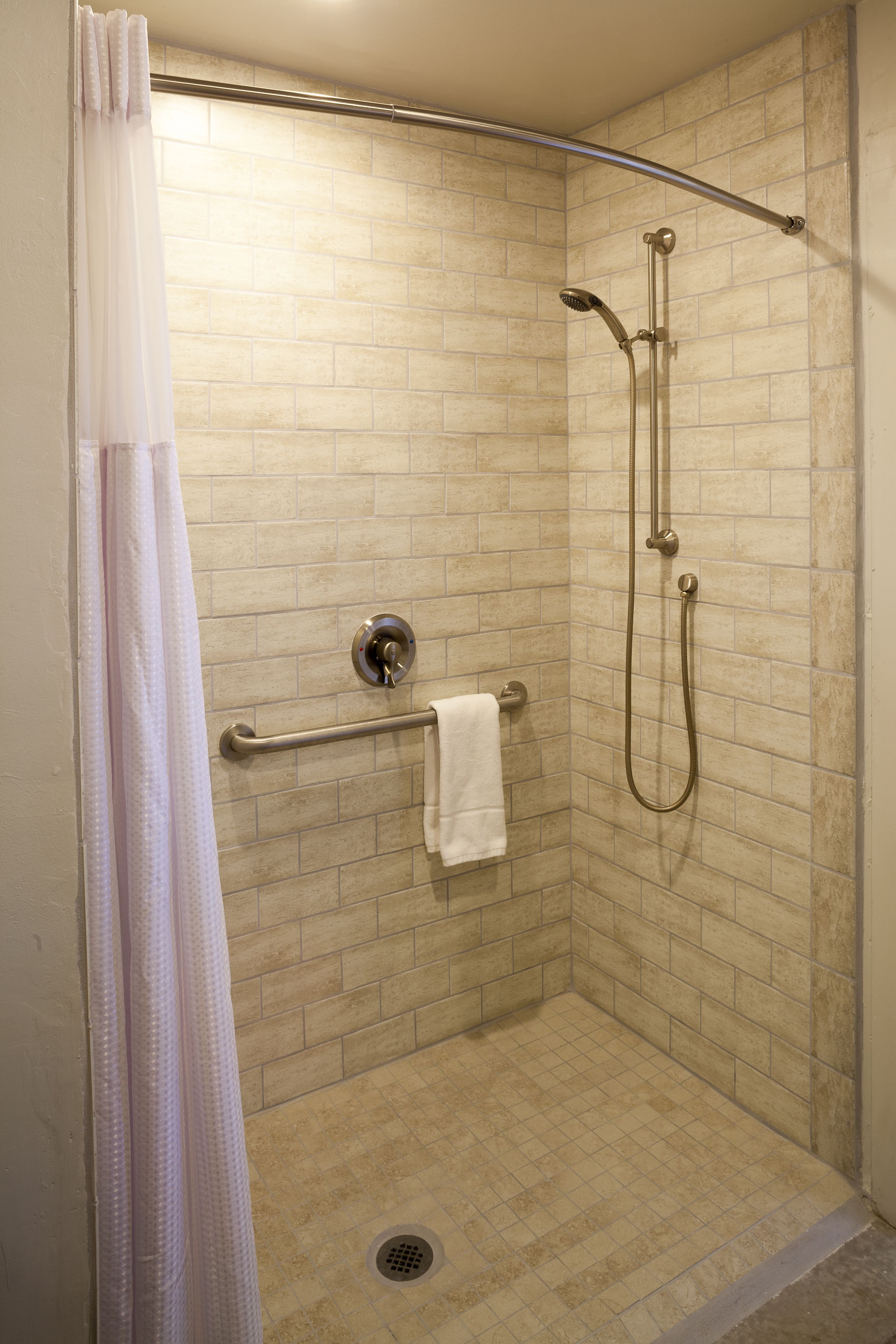 deluxe room, 1 queen bed, accessible, refrigerator & microwave | bathroom | combined shower/bathtub, free toiletries, hair dryer