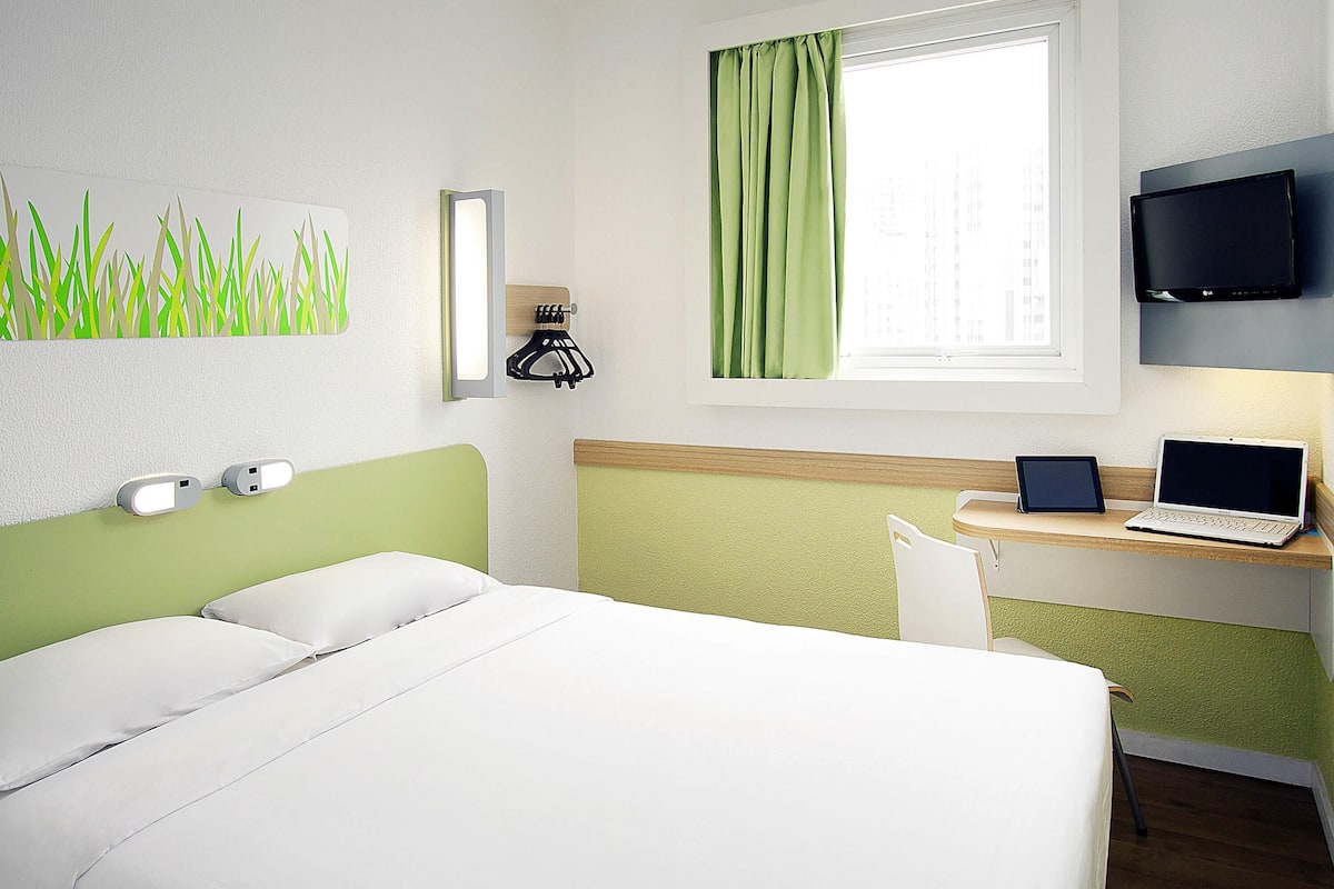 Desk, laptop workspace, blackout drapes, soundproofing