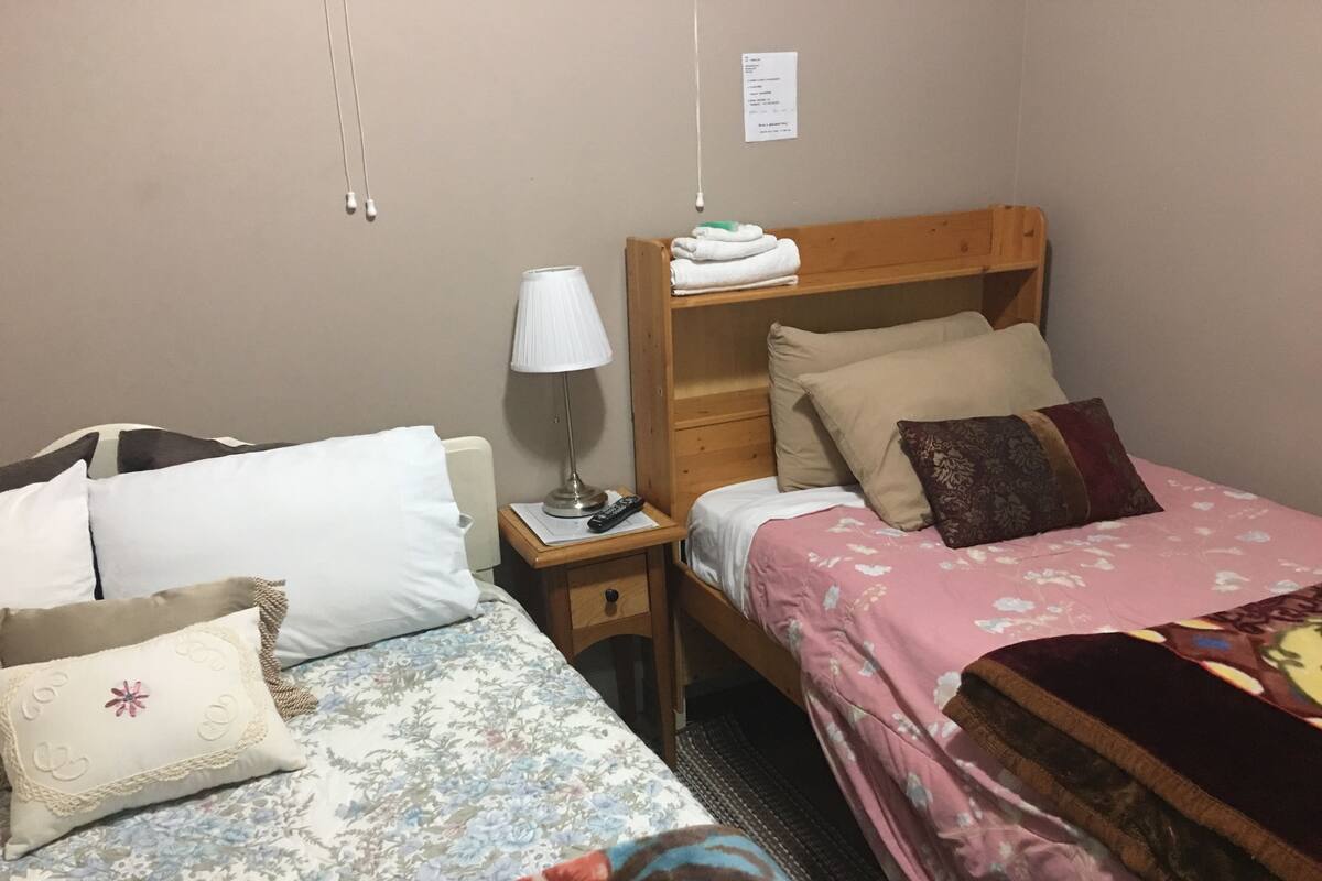 Economy Twin Room, 2 Twin Beds, Shared Bathroom | Free WiFi, bed sheets