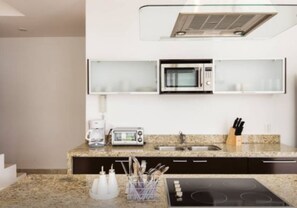 Comfort Penthouse, 2 Bedrooms, Garden View, Garden Area | Private kitchen | Full-sized fridge, microwave, oven, stovetop - Radiant 2BR PH in private location by Happy Address (Playa del Carmen)